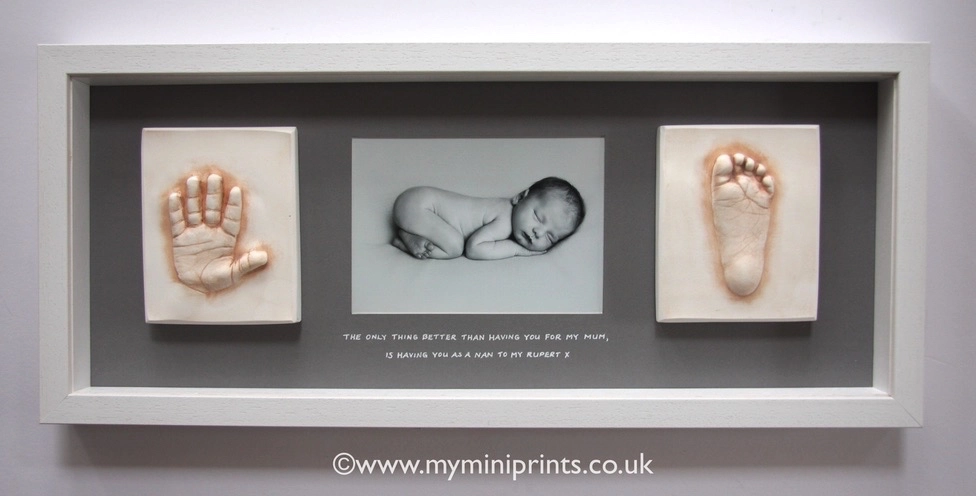 Hand & foot cast on granite backing